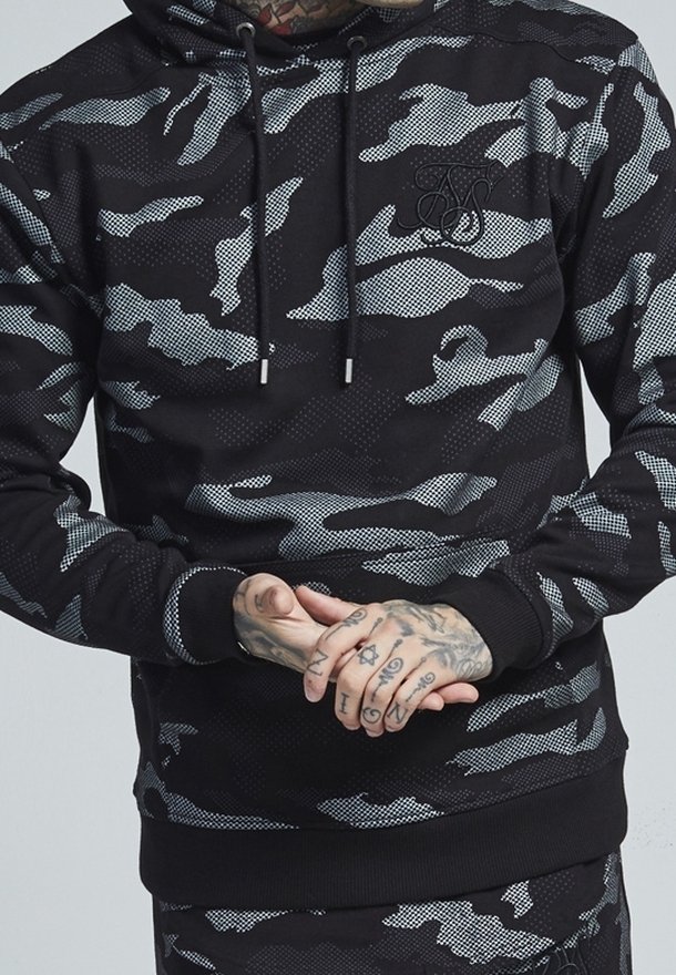 Black and gray camo pullover hoodie with a drawstring hood, ribbed cuffs, and hem; features a textured fabric and a subtle logo on the chest.