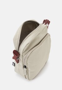 Nike Sportswear HERITAGE CROSSBODY UNISEX - Mala a tiracolo - stone/stone/bronze eclipse