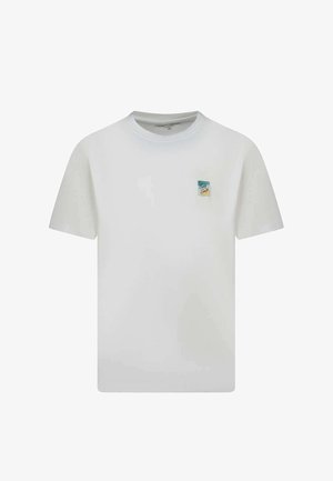 T-shirt blanc à manches courtes et col rond avec un petit motif coloré "Soleil Soleil" sur le côté gauche de la poitrine.