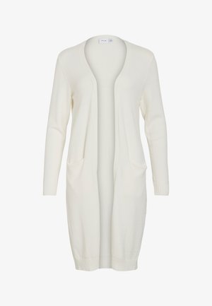 Pitkä valkoinen neuletakki, joka on valmistettu pehmeästä materiaalista. Siinä on V-pääntie, avoin etuosa, ribbatut hihansuut ja kaksi etutaskua.