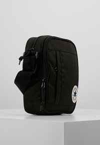 sac converse homme argent