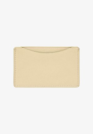 Porta carte in pelle beige dalla texture liscia, con bordo superiore curvo e cuciture bianche ai lati per un dettaglio in più.