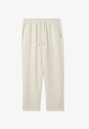 Pantaloni leggeri beige, comodi e larghi, con elastico in vita e cordoncino. Presentano due tasche laterali e un design a gamba dritta.