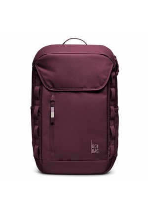 Zaino in tessuto color marsala con coperchio imbottito, tasca laterale con zip, stampa del logo e spallacci laterali testurizzati per un trasporto sicuro e un facile accesso.
