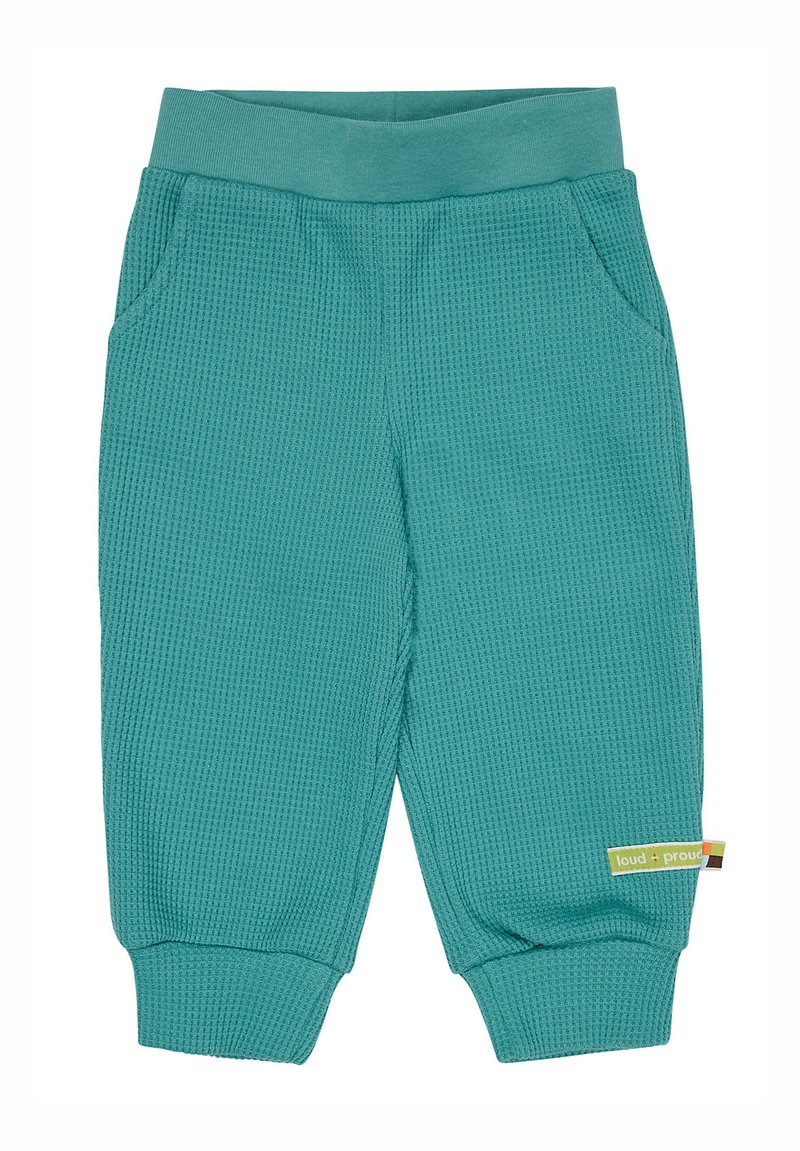 Pantaloni texurizzati in teal con cintura elastica ampia e due tasche laterali. Presentano polsini a costine e un piccolo modello con logo sul lato.