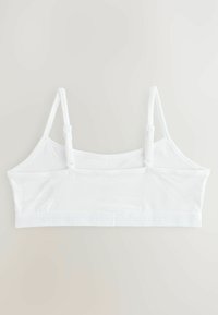 Biały bawełniany biustonosz typu bralette z regulowanymi ramiączkami i gładką fakturą. Posiada haftowaną opaskę z logo u podstawy oraz prosty design.