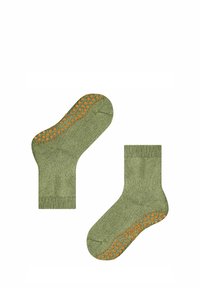 Chaussettes en coton vert avec une semelle à motif texturé orange antidérapante, un bord côtelé à la cheville et une finition en tricot lisse.