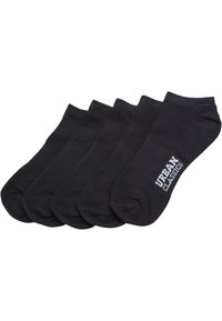 Chaussettes de cheville en coton noir, pack de cinq, avec un design côtelé et le logo "URBAN CLASSICS" en blanc sur le côté. Texture lisse et forme simple.