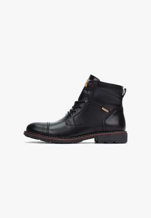 Schwarze Knöchelschuh-Stiefel aus Leder und Netzmaterial, mit runder Zehenpartie, Schnürung vorne, gestickten Akzenten und einer strukturierten Gummisohle.