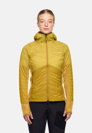 Quilted hooded jacket in mustard yellow, featuring a zip front and contrasting tan accents. Textured panels and fitted sleeves detail design.