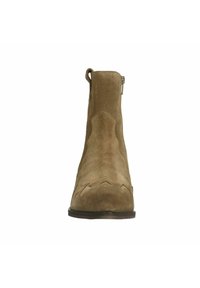 Brown suede ankle boot featuring a smooth texture, pointed toe, decorative stitching, and a small ankle loop for easy wearing.