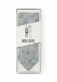 Grau gemusterte Paisley-Krawatte, präsentiert in einer Schachtel, mit einem strukturierten Muster und spitzer Spitze. Das Etikett der Schachtel enthält eine witzige Illustration und den Text "ECHTE JUNGS".