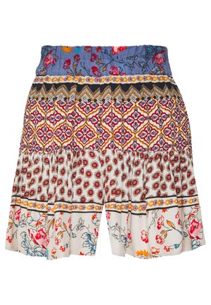Jupe de style bohème avec un tissu à motifs multiples présentant des motifs floraux, géométriques et botaniques aux tons bleu, rouge, orange et blanc.