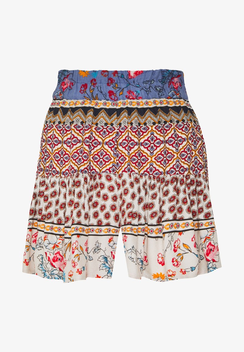 Jupe de style bohème avec un tissu à motifs multiples présentant des motifs floraux, géométriques et botaniques aux tons bleu, rouge, orange et blanc.