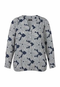 Navyblaues und weißes gemustertes Blusenshirt mit V-Ausschnitt, langen Ärmeln und Knopfdetails. Es hat geometrische Formen und gestreifte Muster.