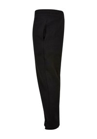 Pantalon de survêtement noir fuselé avec taille élastique et poche latérale, présenté en vue latérale sur fond blanc.