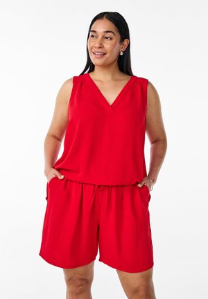 Roter ärmelloser Jumpsuit mit V-Ausschnitt, elastischem Bund und seitlichen Taschen; aus leichtem Stoff, der eine entspannte Passform bietet.