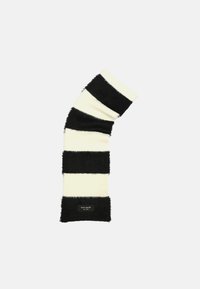 Black and white striped scarf made of soft, fuzzy material; features alternating wide stripes and a small label with brand name.