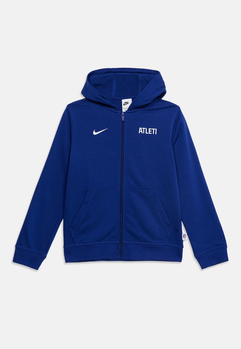 Μπλε φούτερ Nike με φερμουάρ σε όλο το μήκος, κουκούλα, μπροστινές τσέπες, λευκό λογότυπο Nike αριστερά στο στήθος και κείμενο "ATLETI" δεξιά στο στήθος.