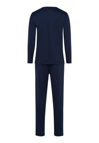 Granatowa bluzka z długim rękawem i pasujące spodnie wykonane z miękkiego materiału. Prosty design z prostym krojem i bez widocznych wzorów czy akcentów.