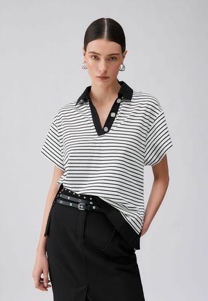 STRIPED WITH BEJEWELLED BUTTONS - Polo - black