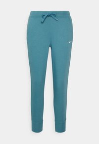 Türkisfarbene Sweatpants aus weichem Material, mit einem Kordelzugbund, elastischen Knöchelabschlüssen und einem kleinen weißen Logo auf dem linken Oberschenkel.