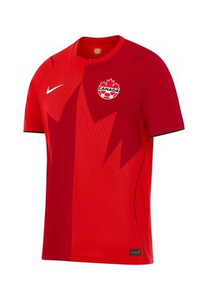 Czerwona koszulka piłkarska Kanady z ciemnym wzorem liścia klonu, logo Nike na prawej piersi i emblematem Kanadyjskiego futbolu na lewej piersi.
