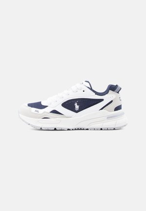 White and navy athletic sneaker with mesh and leather panels, lace-up design, cushioned sole, and a polo player logo on the side.