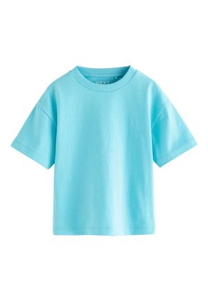 Camiseta de algodón de manga corta en azul claro con cuello redondo acanalado y corte holgado.