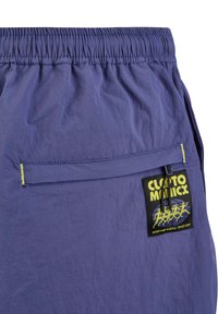 Purple shorts with elastic waist, fabric texture shown, featuring a side pocket with a yellow zipper and a branded patch on the back.