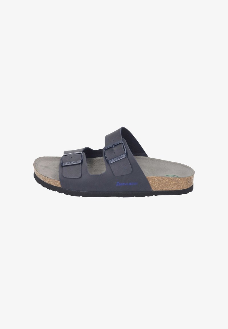 Black slide sandals with two adjustable straps, cork footbed, textured grey insole, and rubber sole. Features branding on the side.