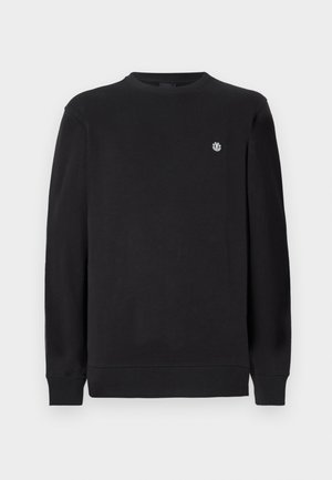 Black long-sleeve crewneck sweatshirt with small white circular logo on left chest, ribbed cuffs, and hem.