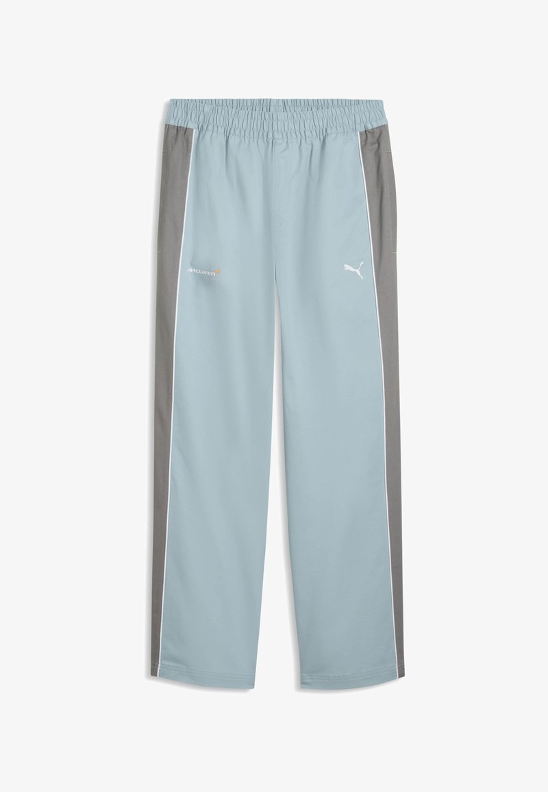 Pantalon de sport bleu clair et gris avec taille élastique, liseré blanc, logo Puma sur la jambe droite et logo McLaren sur la jambe gauche.