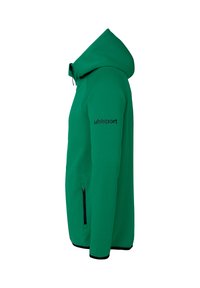 Sweat à capuche vert au design ajusté, fabriqué en tissu texturé, doté d'une poche zippée, d'accents noirs et du logo "uhlsport" sur la manche.
