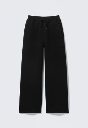 Juodos spalvos plačios kelnės iš minkštos medžiagos, su elastine juosmens juosta su raišteliu ir dviem šoninėmis įstrižomis kišenėmis.