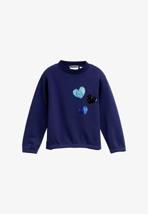 Felpa navy con scollo rotondo, caratterizzata da tre cuori in paillettes blu e nere sul davanti. Maniche e orlo a costine.