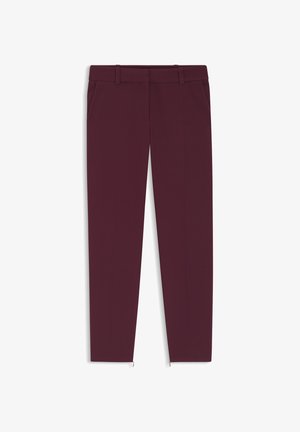 Burgundy tailored pants with a smooth fabric, slim fit, two side pockets, and zips at the ankle for added detail.