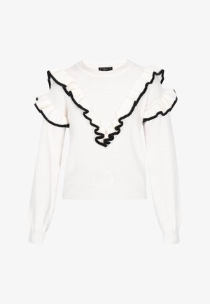 Valge sviiter sügava V-kaelusega, kaunistatud mustade volangide äärega kaeluse ja varrukate ümber. Kootud kangas, pikad ja söanduvad varrukad.