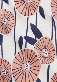 Cotton fabric featuring a floral pattern with pink-orange flowers and dark blue leaves on a white background.