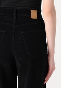 ONLY Tall ONLHOPE GLOBAL HIGH WAIST WIDE  - Trousers - black