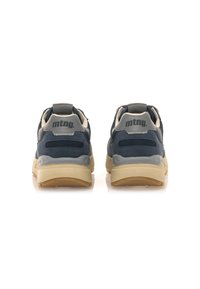 Zapatillas azul marino con parte superior de malla texturizada, detalles en gris y suela de goma beige. Presentan un refuerzo acolchado en el talón y un detalle del logo.