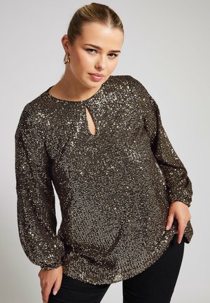 Blouse en sequins bronze avec un col rond, détail en trou de serrure et manches bouffantes longues. Texture douce avec une coupe décontractée.
