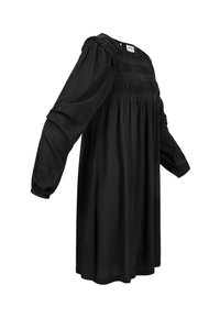 Robe noire à manches longues, corsage smocké et jupe fluide. Tissu doux avec une coupe décontractée et des détails froncés aux épaules.