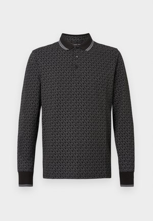 Langermet polo skjorte i svart med subtilt mønstret logodesign. Har en kontrasterende svart krage og mansjetter med hvite striper.