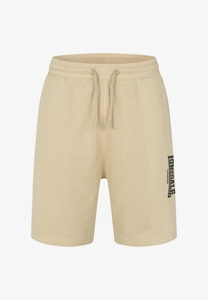 Kreminės spalvos medvilninės šortai su elastinga juosta ir raišteliu. Kairėje kojoje yra juodas logotipas. Klasikinis kirpimas ir minkšta tekstūra.