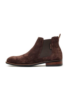 Brown suede Chelsea boot with elastic side panel, pull tab at heel, and wooden sole with low heel on a white background.