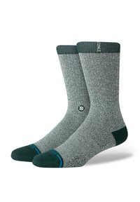 Gray socks with a textured knit design, green heel and toe accents, and a ribbed cuff. Features a small logo on the side.