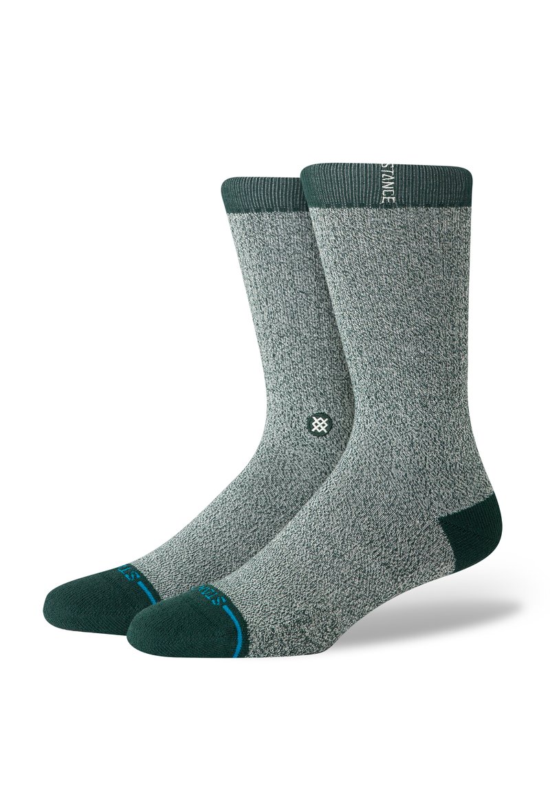 Gray socks with a textured knit design, green heel and toe accents, and a ribbed cuff. Features a small logo on the side.