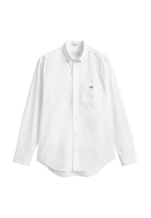 Camicia bianca a maniche lunghe con bottoni, realizzata in cotone, con taschino sul petto sinistro e orlo arrotondato. Nessun motivo o dettaglio visibile.