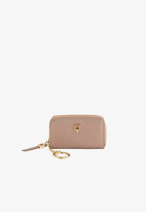 Light pink textured wallet with a smooth finish, gold hardware, and a keychain attachment, featuring a zip closure and logo detail.